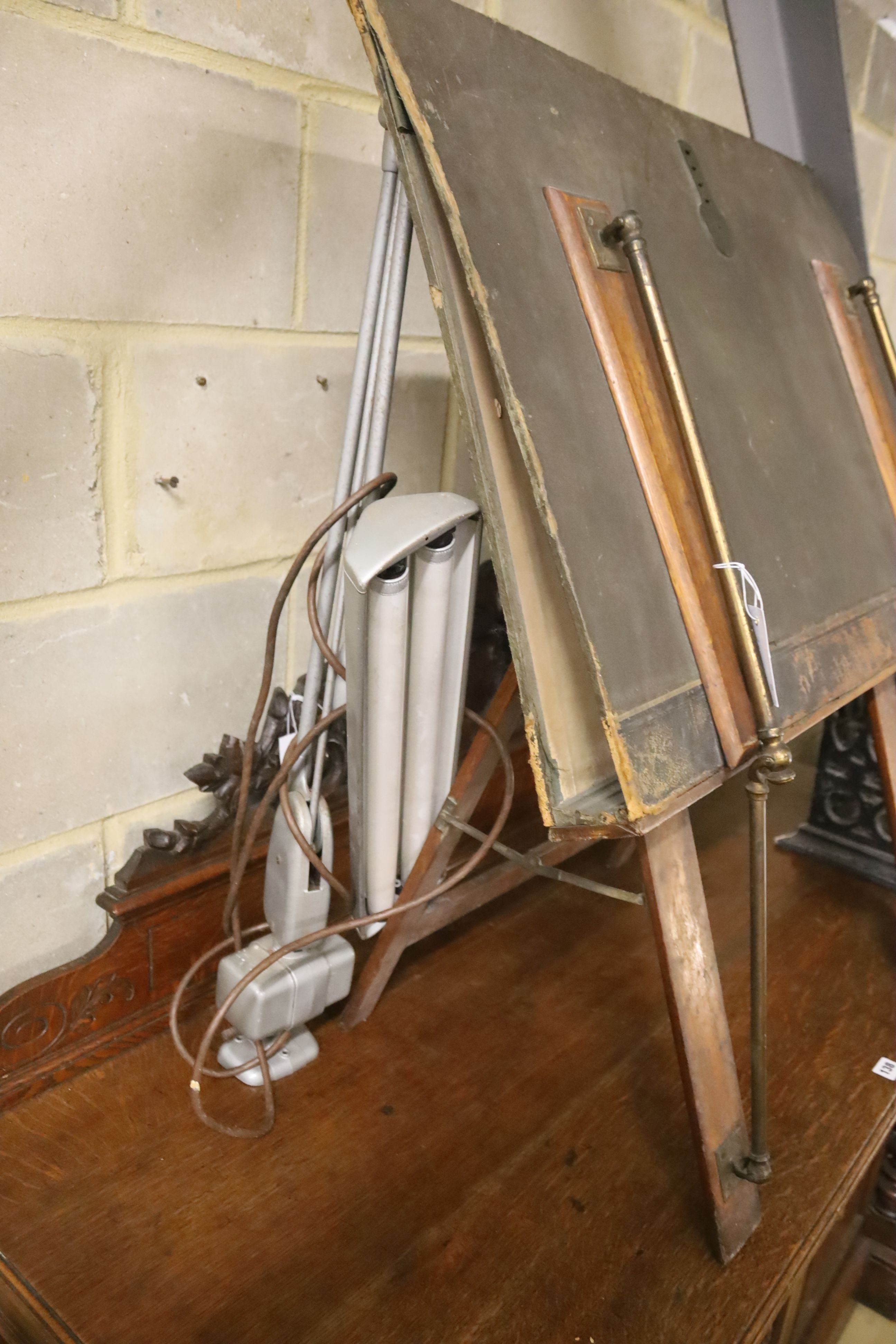 An early 20th century brass mounted folio stand together with a reading lamp